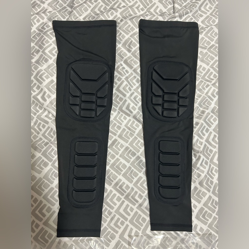 NIB black Leg pads/ arm pads however you want to wear them